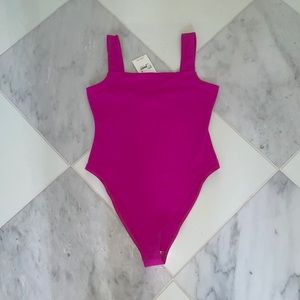 Hot pink body suit